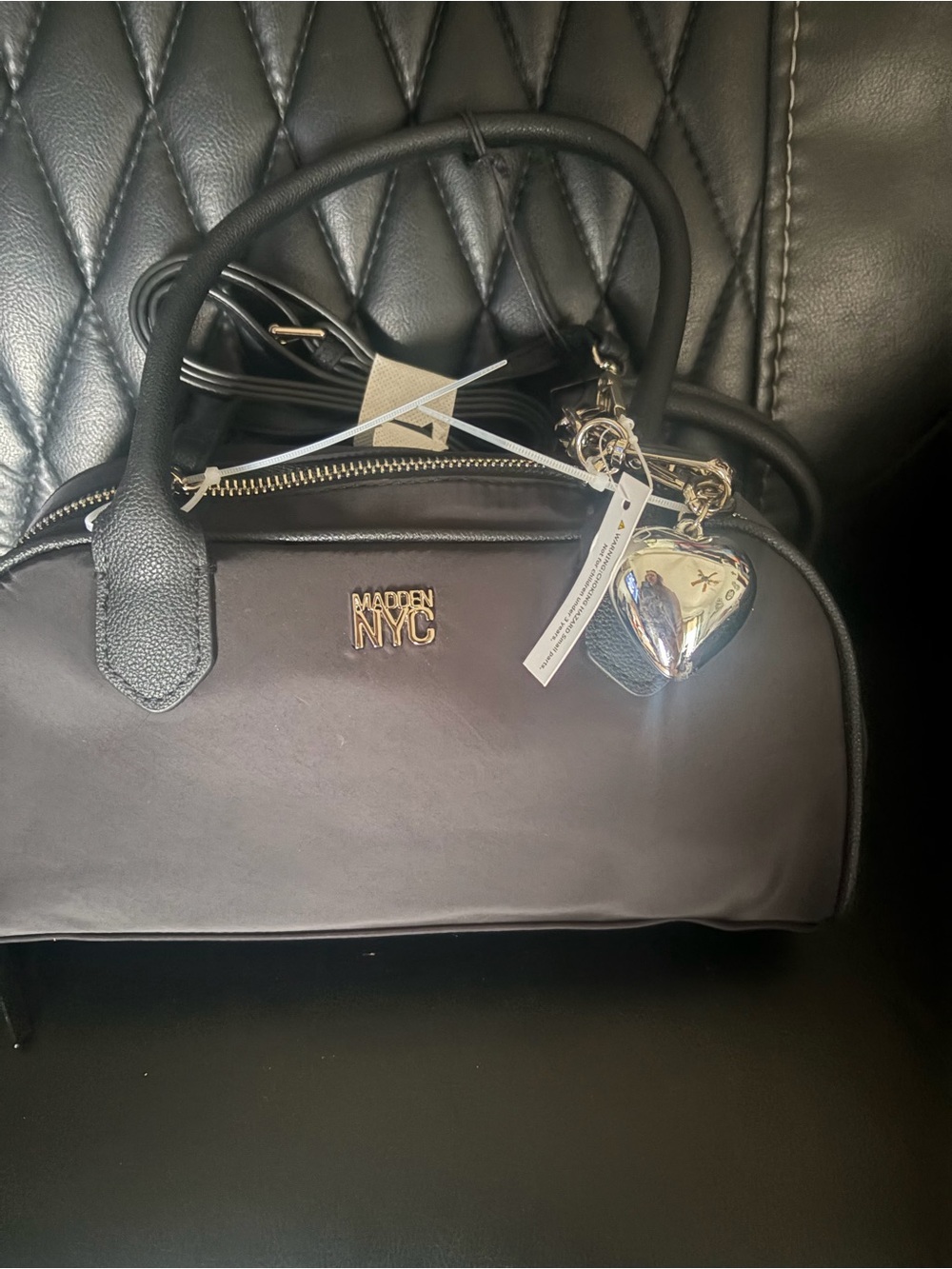 Madden NYC Women's East West Bowler Bag with heart charm black